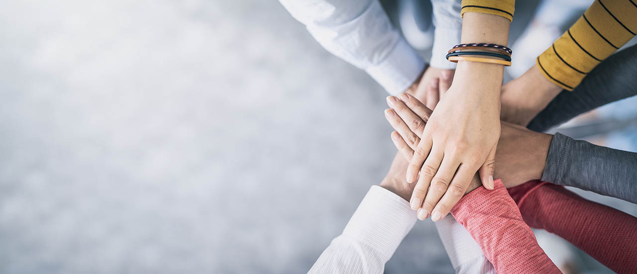 Stack of hands. Unity and teamwork concept.